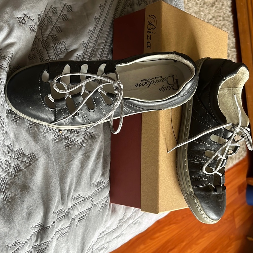 Black leather, grey stitching, comfortable, stylish, made in Portugal
